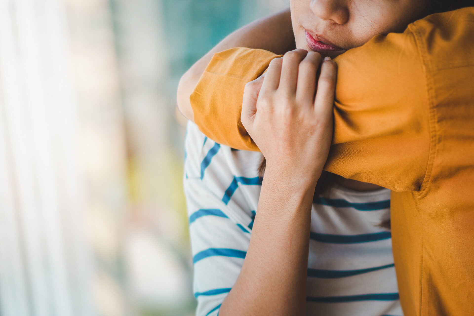 Person hugs their loved one affected by addiction and a mental health disorder