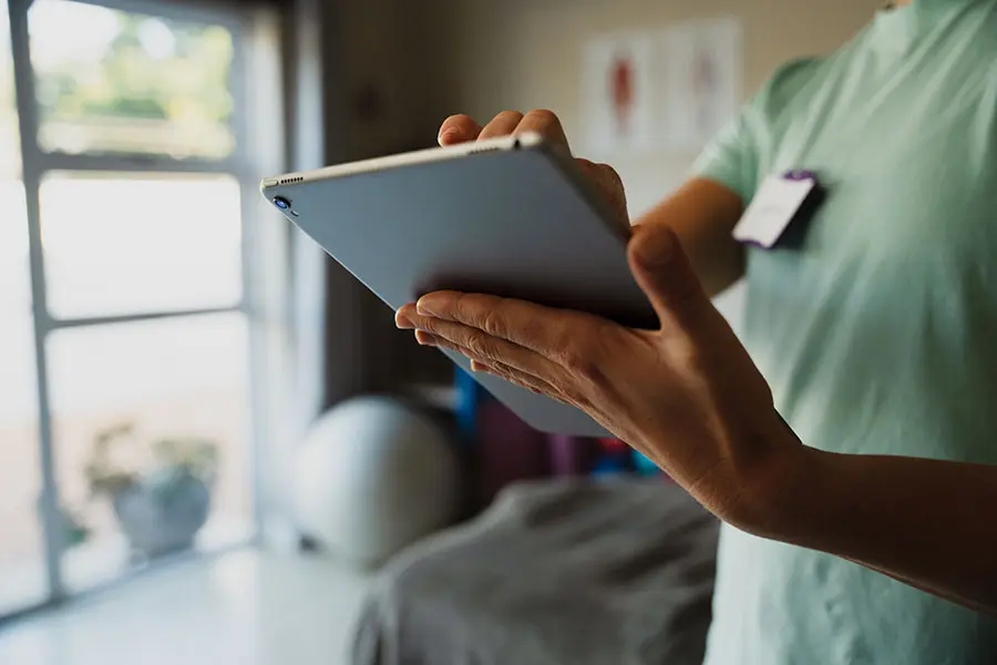 A addiction treatment counselor conducts a virtual treatment session